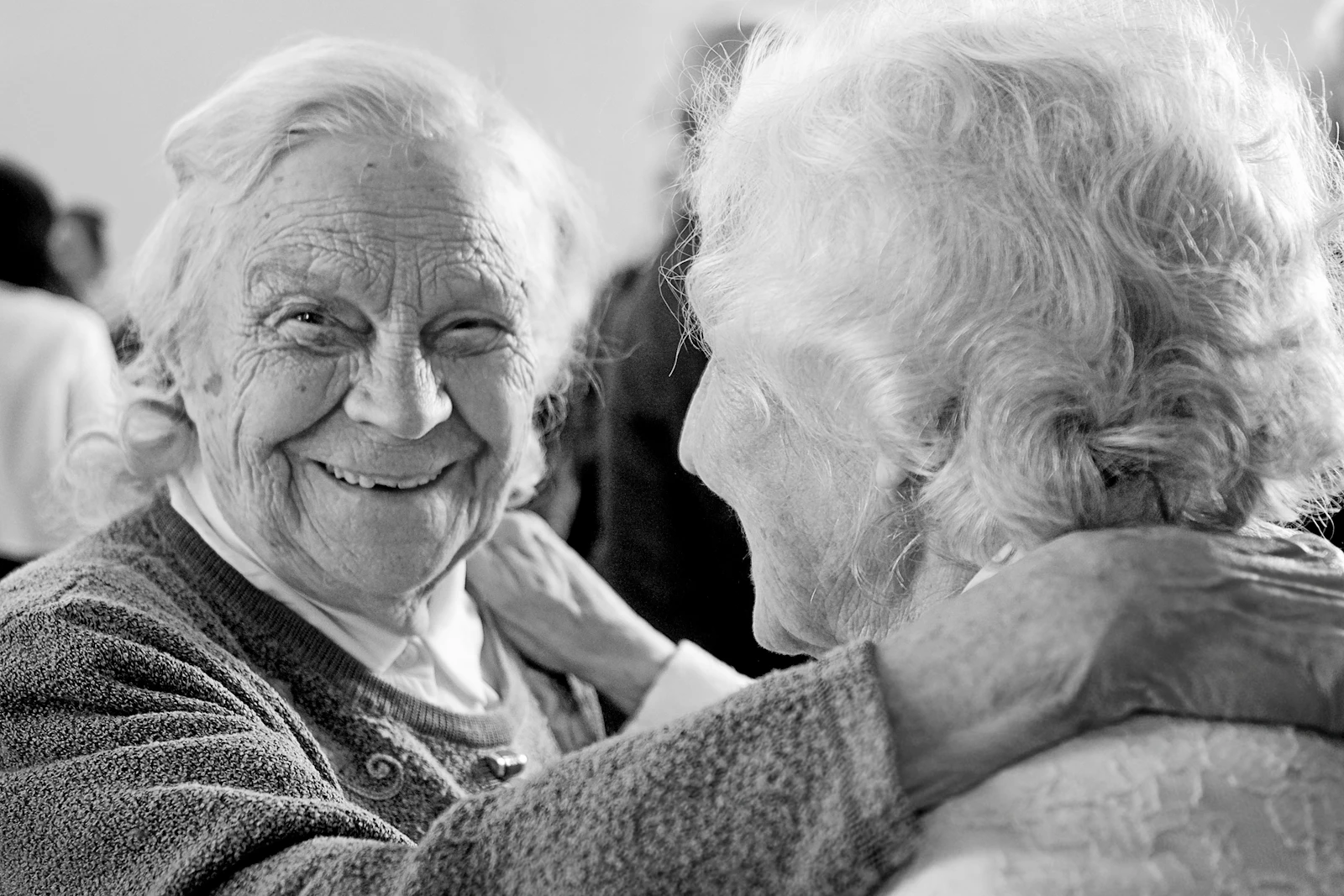 Seniors smiling together in assisted living community